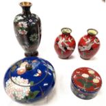 A group of cloisonne vases and items including a pair of red ground vases with cranes lobed vase etc