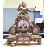 A 19th century gilt metal and pink ground Sevres style porcelain mantle clock surmounted by a
