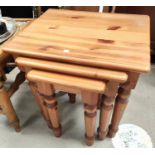 A pine nest of 3 occasional tables; a small work table; a wheel back armchair