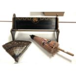 An oriental lacquered bookrack; an oriental parasol and fan