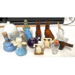 A selection of vintage Avon and other scent bottles in the form of dogs etc