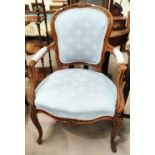 A Louis XV style stained walnut armchair in light blue fabric