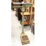 A set of cast metal floor standing mediacal scales in green and chrome