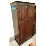 A Jacobean style carved oak bedroom suite of 4 pieces comprising double door wardrobe, 4 height