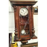 A mahogany cased Vienna wall clock