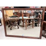 An Edwardian wall mirror in rosewood frame with rectangular bevelled glass plate, 70 x 91cm overall