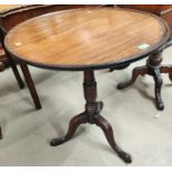 A Georgian Mahogany tilt top tripod occasional table with circular top with raised rim lip, diameter