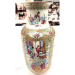A 19th century Chinese famille rose Rullo vase with polychrome panels depicting traditional scenes