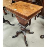 A rectangular walnut work table with hinged lid and fitted interior tapering well & 4 carved