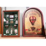 A reproduction wooden sign Geo Blunts Balloon Flight in relief and a cased display golf