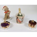 A Royal Crown Derby miniature Champagne bottle, ice bucket and two Caverswall miniature ceramic