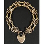 A 9ct gold gate link bracelet with heart locket, 14gm.