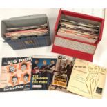 Two record cases containing around 50 pop singles