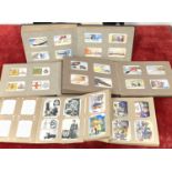 PRE WAR CIGARETTE CARDS: A collection in albums including Uniforms of the Territorial Army and other