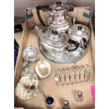 A silver plated matched tea service; a circular tray; a sugar scuttle; a toast rack
