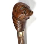 A walking stick with seals head terminal with glass eyes
