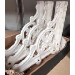 Three cast iron aesthetic movement style wall supports in white.