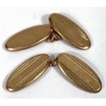 A pair of 9ct gold engine turned cufflinks, 3.2gms.