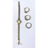 A 9ct gold ladies wristwatch, case and strap gross 8.4gm and three costume rings