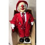 A model of a clown in a red suit, ht 53cm