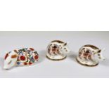 Royal Crown Derby Paperweights: Two Imari pattern Piglets LVIII and another sleeping Piglet LXII