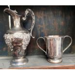 A silver plated double handled loving cup, stamped W.R with crown; a lidded claret jug with acanthus