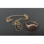 A 9ct gold Gent's signet ring and a fine 9ct gold necklace and 'E' pendant, 5.8gms.