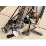 A selection of vintage wooden shafted golfclubs, a 20th century Indian display sword etc