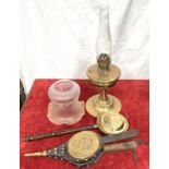 An oil lamp with brass reservoir and glass shade, a small pair of bellows, a mini bed warmer,