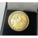 An EVII half sovereign set in a 9 carat hallmarked gold ring, gross weight 9.9gm
