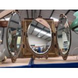 A gilt triple dressing table mirror, a converted table lamp with opaque glass and shade