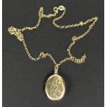 A 9 carat hallmarked gold chased oval locket on 9 carat hallmarked gold belcher chain, 6.1gm