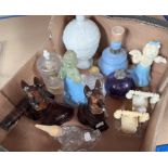 A selection of vintage Avon and other scent bottles in the form of dogs etc