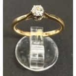 A yellow metal ring set diamond solitaire, 3.5mm diameter approx, size K/L, 2gm