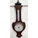 An Edwardian aneroid barometer with thermometer in banjo shaped inlaid rosewood case (glass cracked)