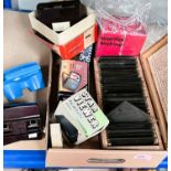 A cased set of 34 glass photographic slides showing people and places; a vintage Viewmaster