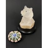 A quartz head carving of a grizzly bear, on marble plinth; a millefiori paperweight