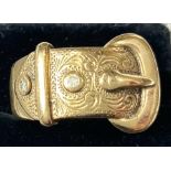A gent's 9 carat gold buckle ring set 2 small diamonds, 18.1gm