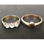 A 9 carat hallmarked gold ring set 3 clear stones, size K/L; a rose gold gem set ring, stamped '