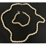 A modern hallmarked gold rope twist chain necklace and matching bracelet, 12gm