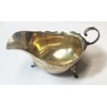 A hallmarked silver sauce boat on hoof feet, Chester 1913, 2.6oz