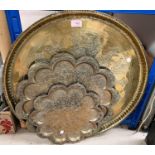 A large circular brass tray; an Edwardian mantel clock; a selection of brassware