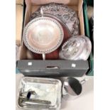 A gallery tray in silver plate and wood; another silver plated tray; a beaten copper wall plaque;