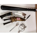 A brass sheathed presentation kukri with horn handle etched blade; a rubber truncheon and a