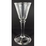 An 18th century balustroid wine glass with folded underfoot rim