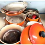 A selection of Le Creuset, graduating oven dishes, lidded pans etc