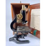 A Prior of London microscope with various magnification lenses, in original box with guarantee