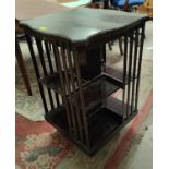 An early 20th century mahogany bookcase with square revolving top and beaded decoration