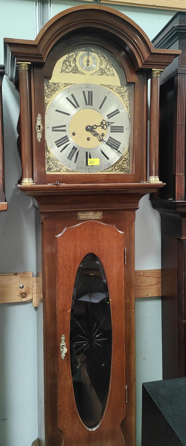 An early 20th century Georgian style mahogany longcase clock with arched hood, brass dial and spring