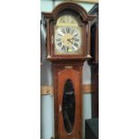 An early 20th century Georgian style mahogany longcase clock with arched hood, brass dial and spring